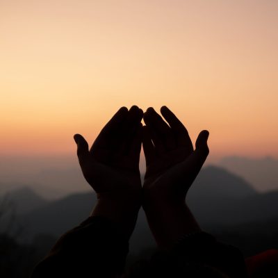 Teenage girl with praying. Peace, hope, dreams concept.